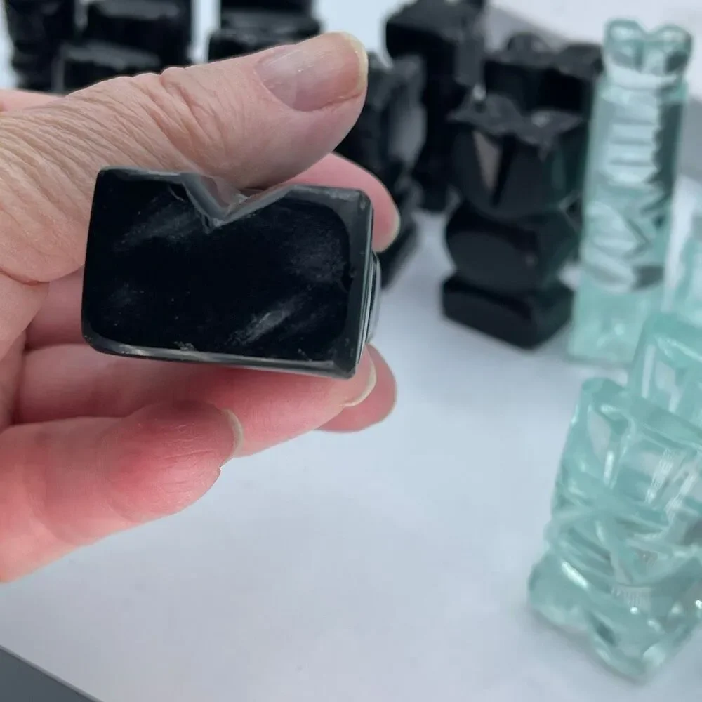 Aztec style chess pieces black obsidian green glass or onyx.